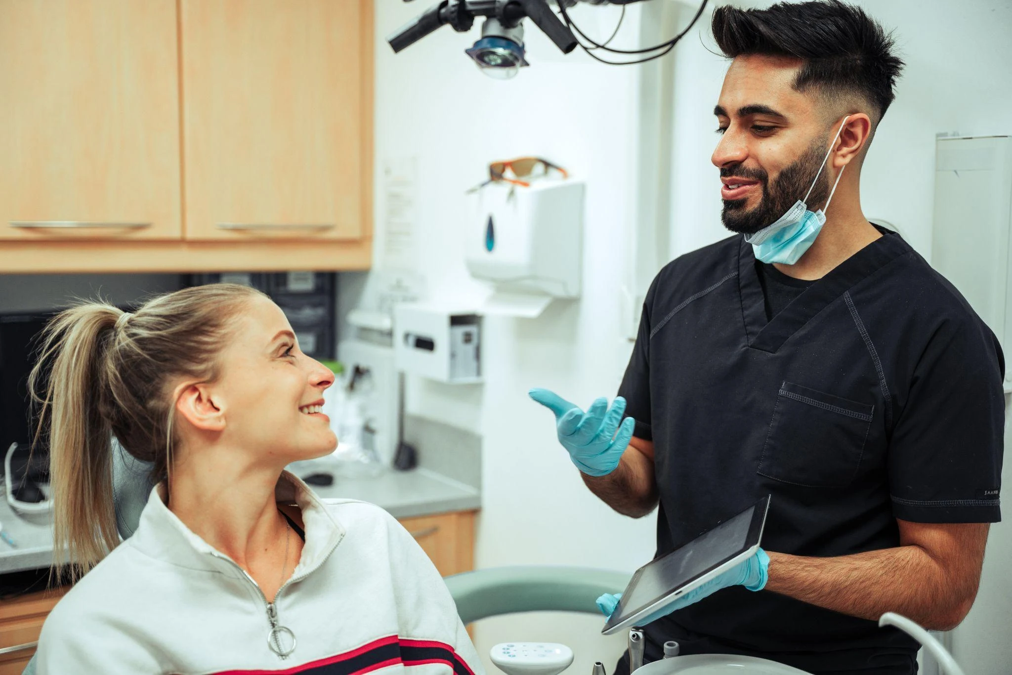 A dentist discussing treatment with a patient